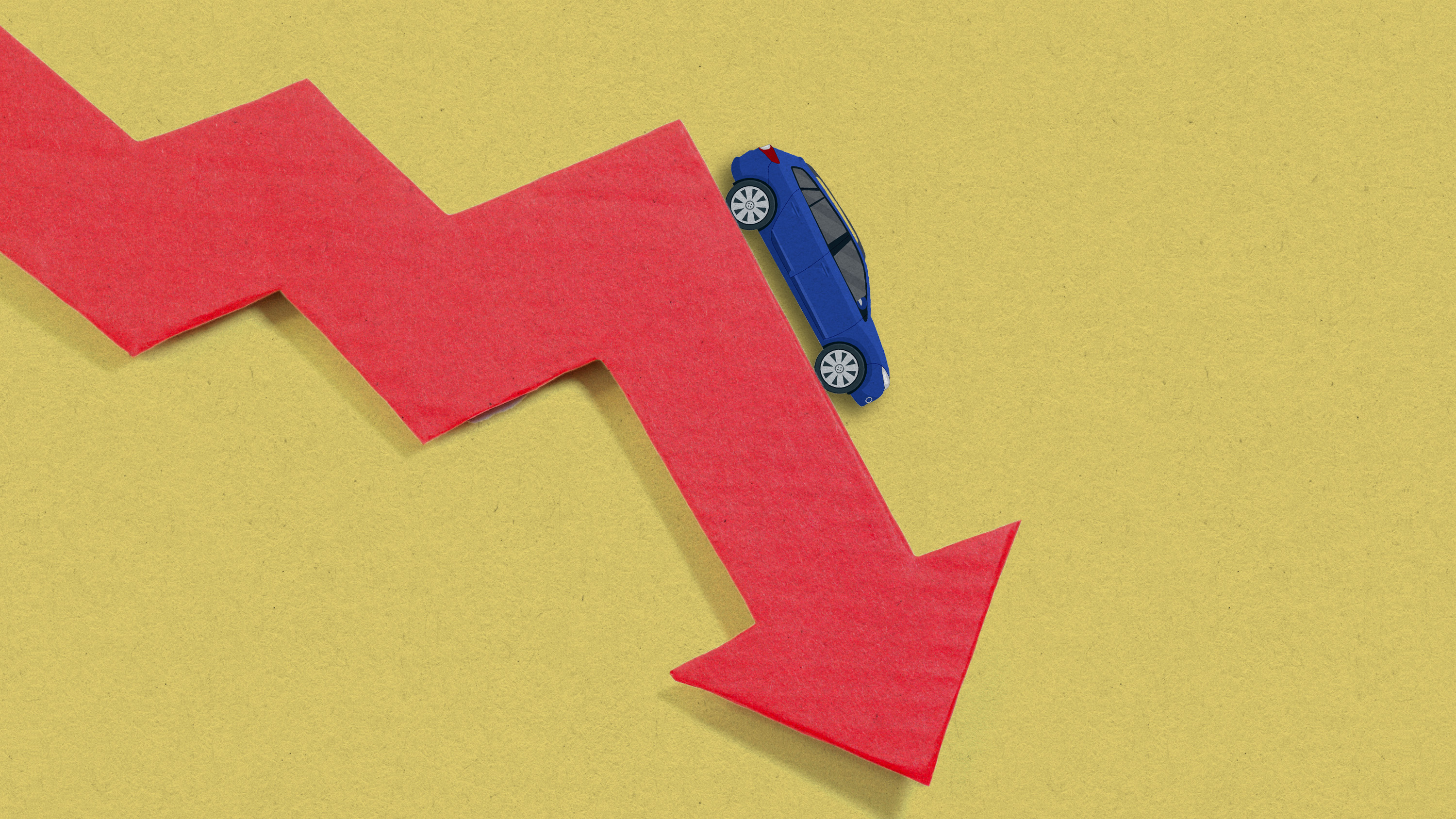 A photo illustration showcasing a car on a downward trending arrow.